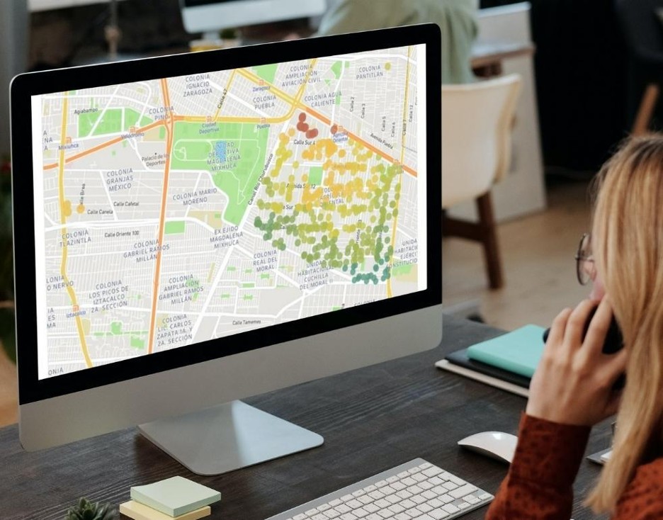 A woman using geolocation data for industry analysis